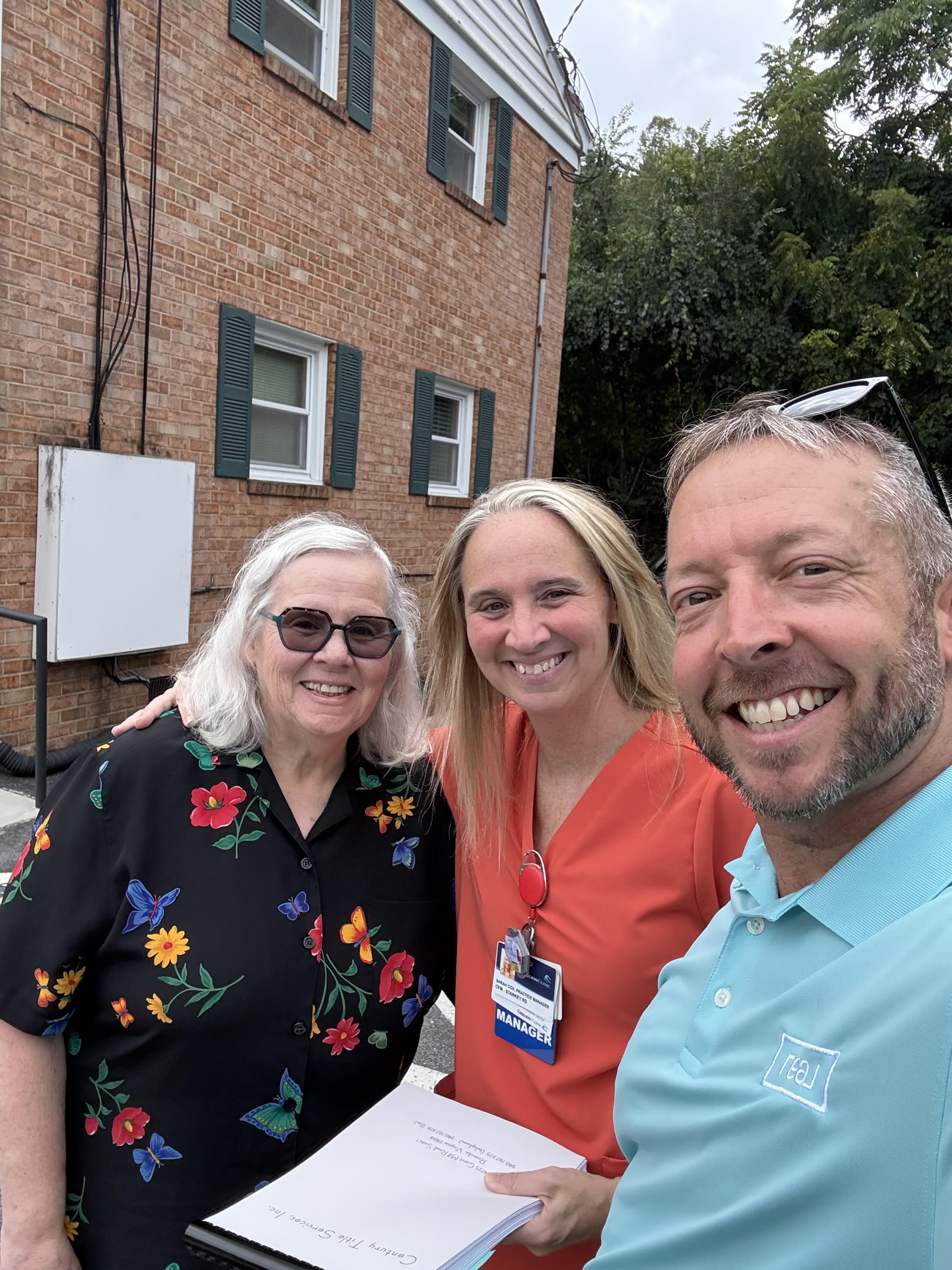 J.R. Wray with clients at a closing in Roanoke, Virginia